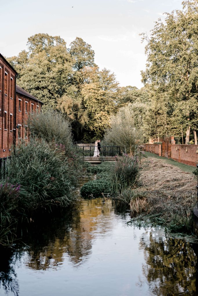 Elegant wedding at the Bombay Sapphire Distillery with unique touches like a karaoke room, Krispy Kreme donuts, and Bombay Sapphire gin cocktails.