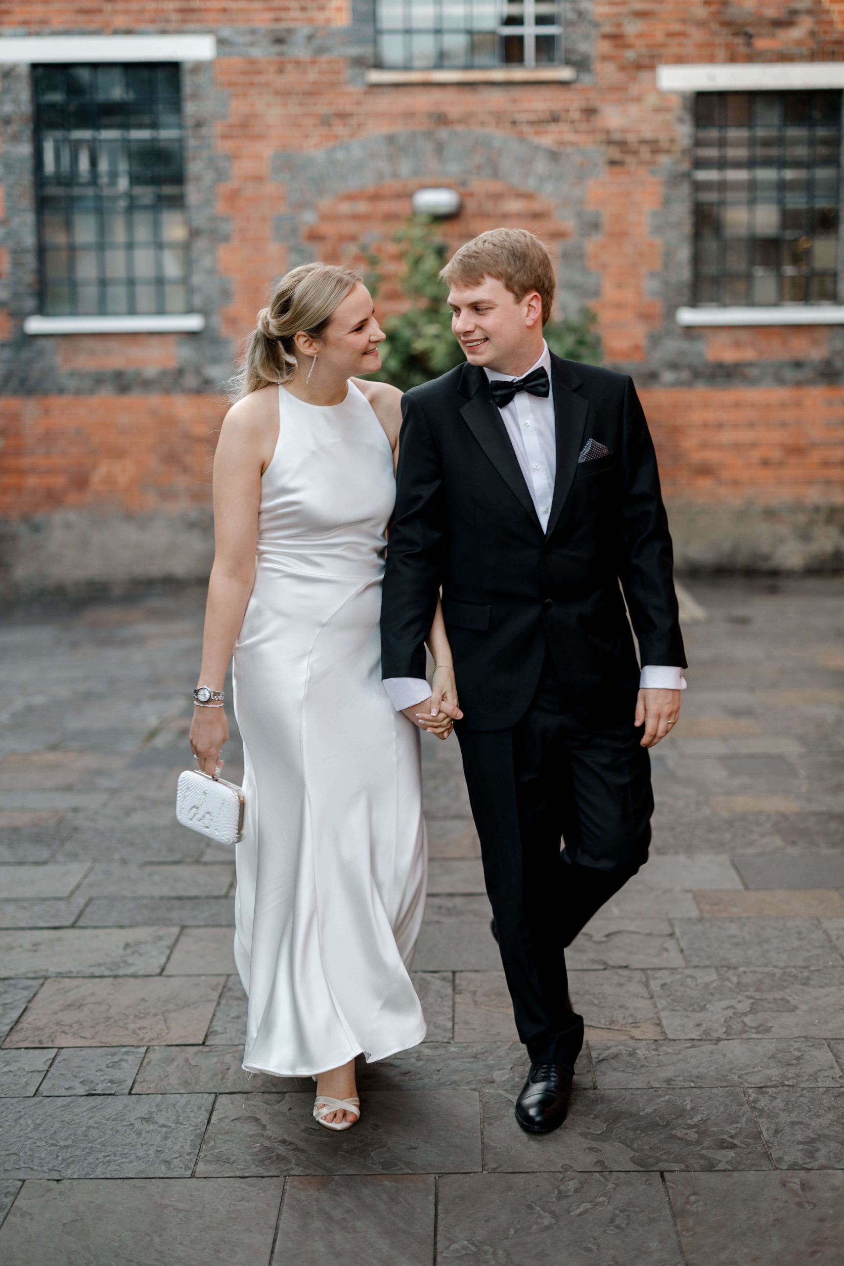 Elegant wedding at the Bombay Sapphire Distillery with unique touches like a karaoke room, Krispy Kreme donuts, and Bombay Sapphire gin cocktails.