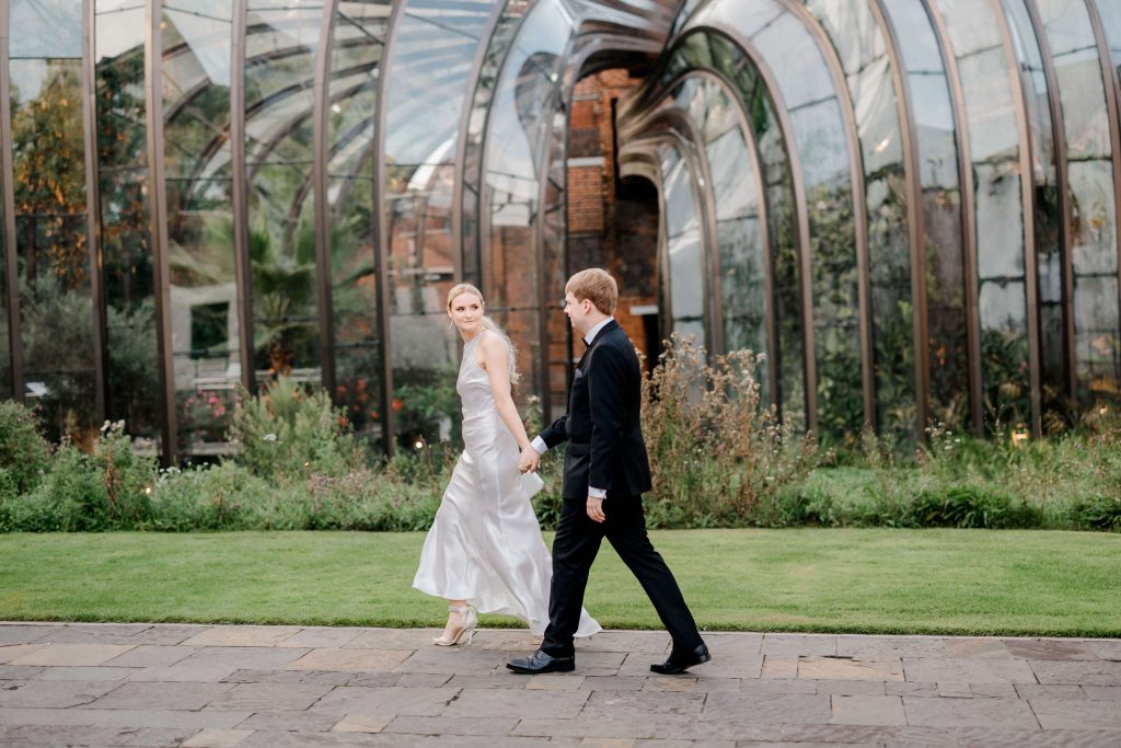 Elegant wedding at the Bombay Sapphire Distillery with unique touches like a karaoke room, Krispy Kreme donuts, and Bombay Sapphire gin cocktails.