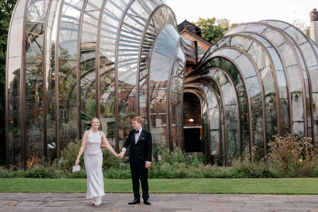 Elegant wedding at the Bombay Sapphire Distillery with unique touches like a karaoke room, Krispy Kreme donuts, and Bombay Sapphire gin cocktails.