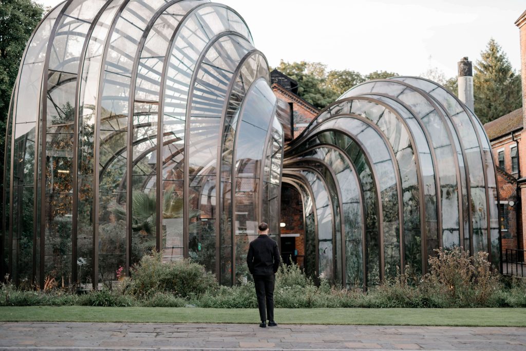Elegant wedding at the Bombay Sapphire Distillery with unique touches like a karaoke room, Krispy Kreme donuts, and Bombay Sapphire gin cocktails.