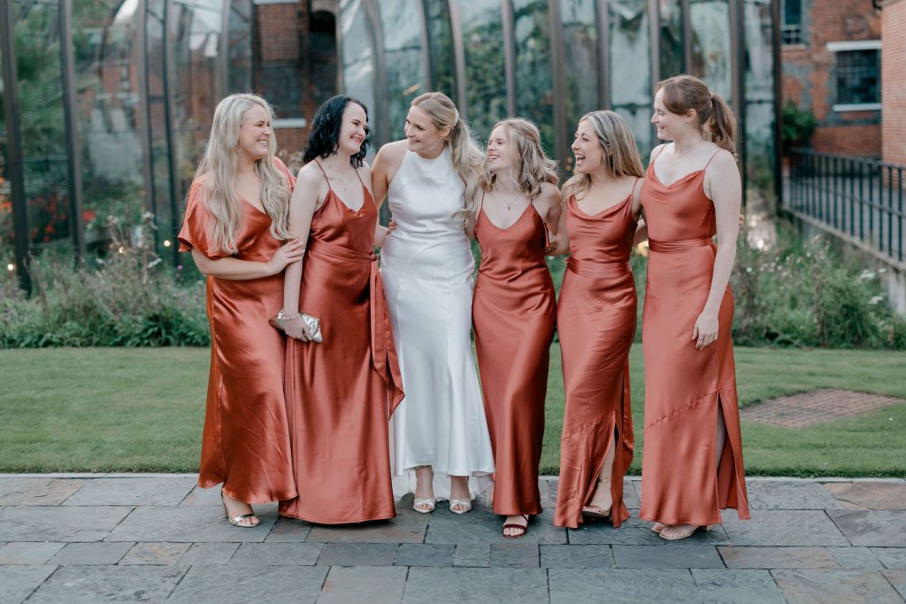 Elegant wedding at the Bombay Sapphire Distillery with unique touches like a karaoke room, Krispy Kreme donuts, and Bombay Sapphire gin cocktails.