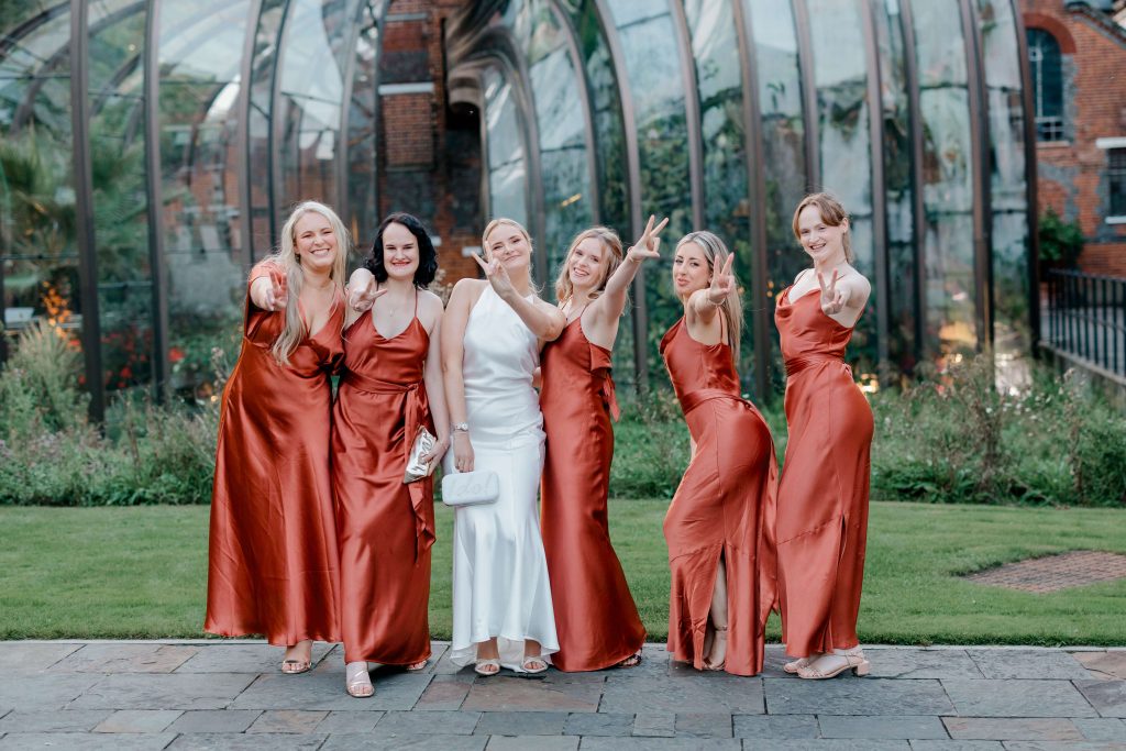 Elegant wedding at the Bombay Sapphire Distillery with unique touches like a karaoke room, Krispy Kreme donuts, and Bombay Sapphire gin cocktails.