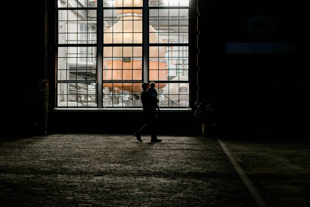 Elegant wedding at the Bombay Sapphire Distillery with unique touches like a karaoke room, Krispy Kreme donuts, and Bombay Sapphire gin cocktails.