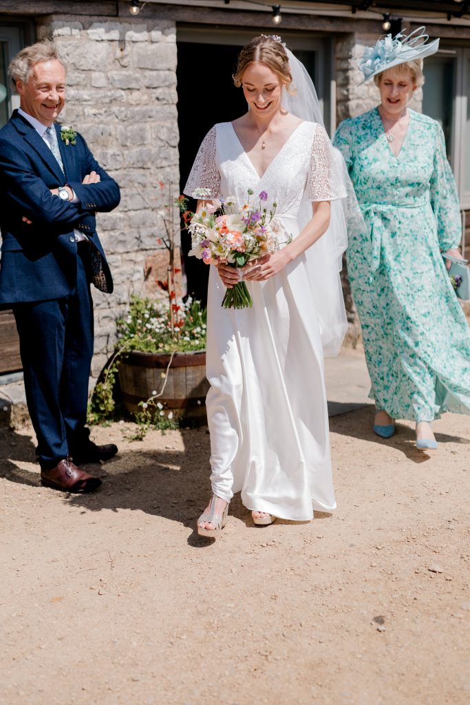 Relaxed wedding photography at Folly Farm Centre in Somerset with beautiful golden light and countryside views.