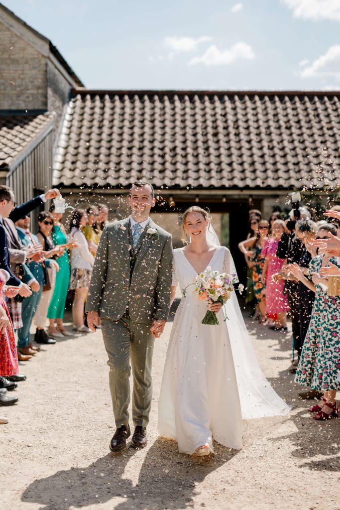 Relaxed wedding photography at Folly Farm Centre in Somerset with beautiful golden light and countryside views.