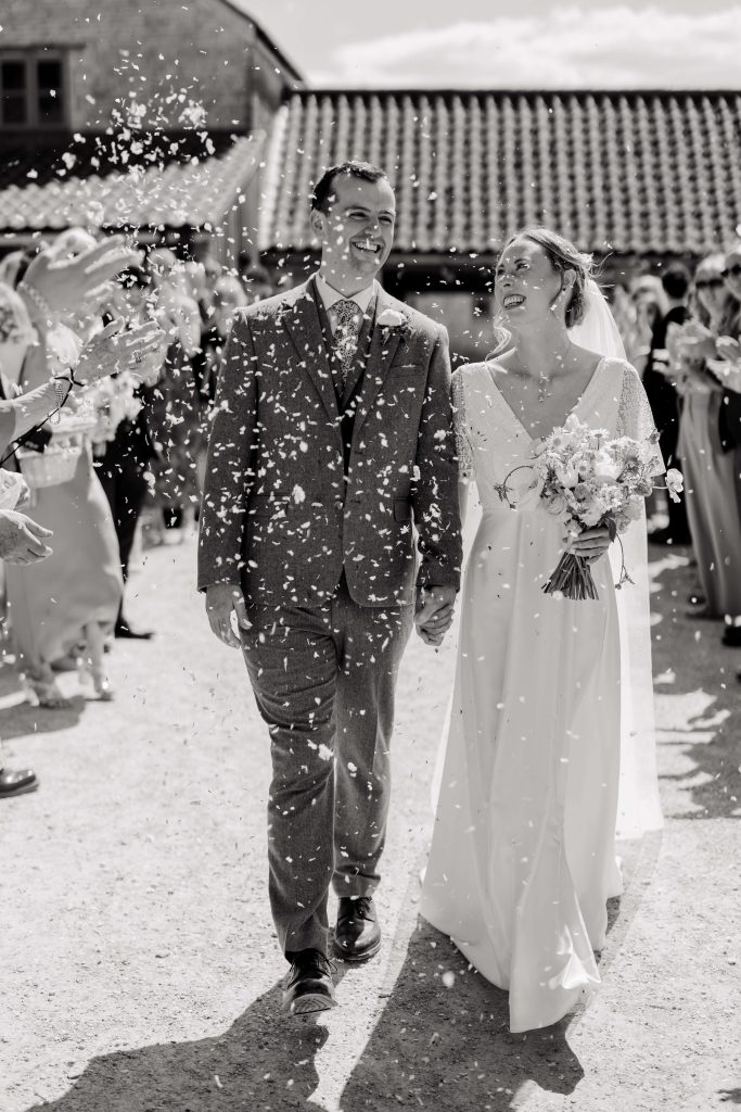 Relaxed wedding photography at Folly Farm Centre in Somerset with beautiful golden light and countryside views.