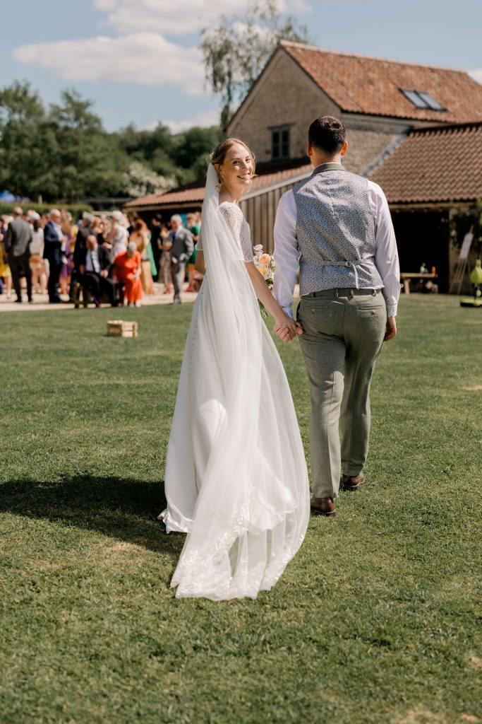 Relaxed wedding photography at Folly Farm Centre in Somerset with beautiful golden light and countryside views.