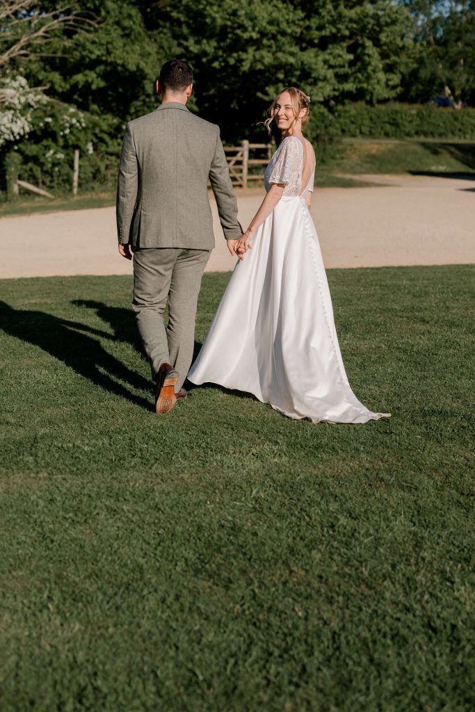 Relaxed wedding photography at Folly Farm Centre in Somerset with beautiful golden light and countryside views.